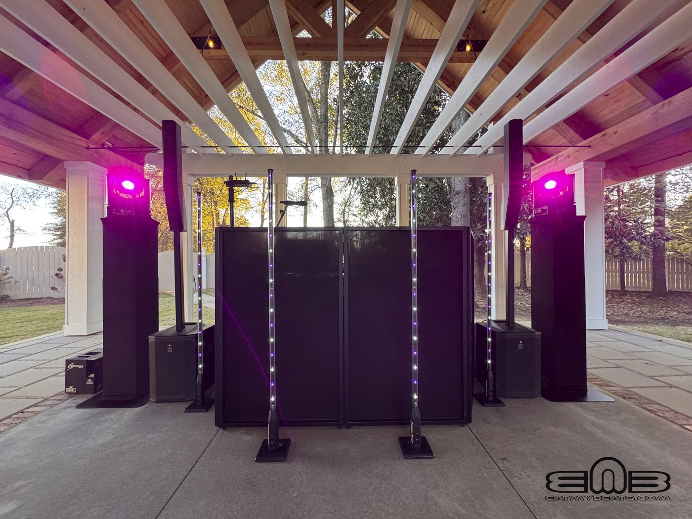 Outdoor wedding ceremony with DJ sound and lighting setup