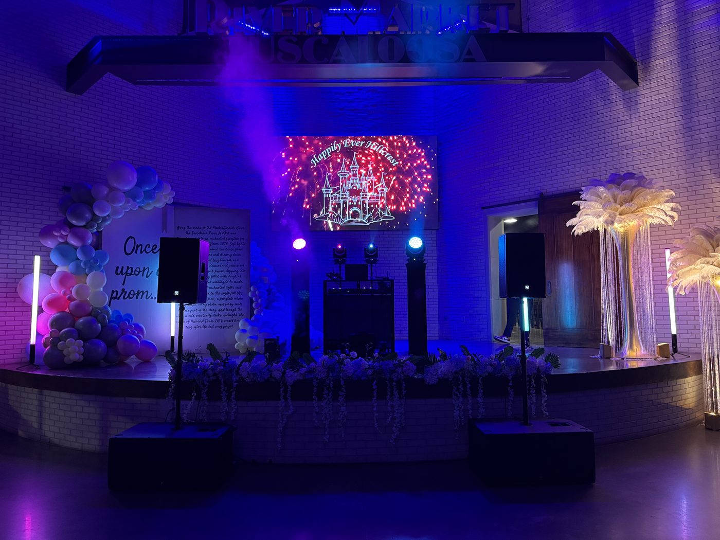 Barn wedding reception with marquee letter sign and live band setup