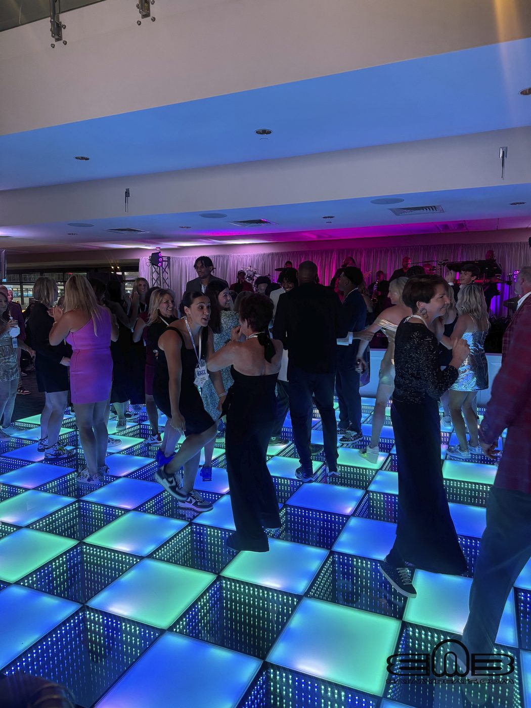 School dance with glow lighting effects on the dance floor